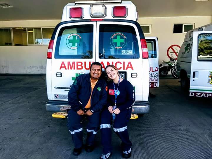 Kaylin and paramedic pedro in front of the Green Cross emergency clinic